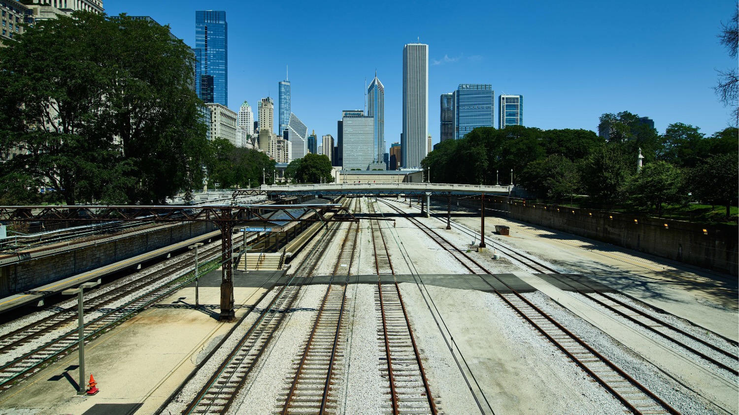 Railroad tracks overlooking a city skyline