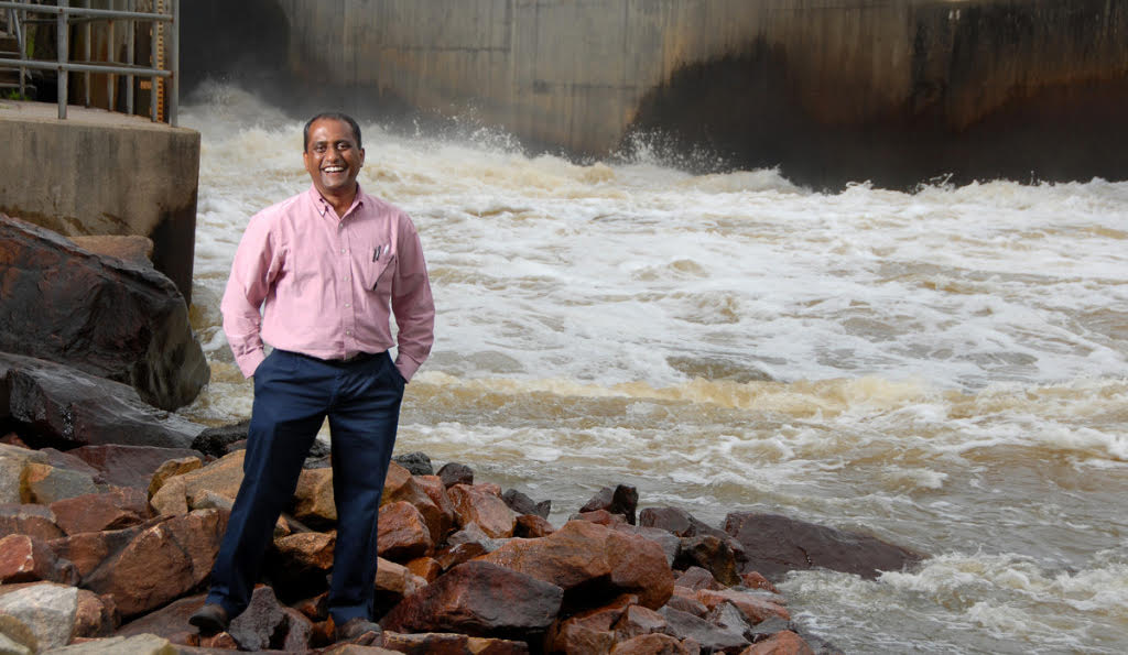 Sankar Arumugam and the spillway at Falls Lake.
